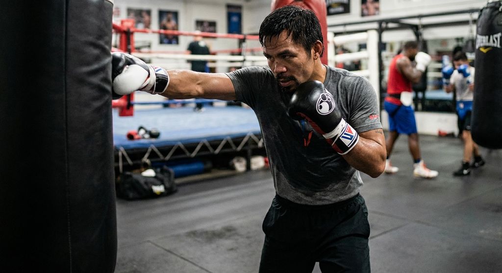 Boxer throwing a powerful straight right cross with perfect hip rotation. Techni