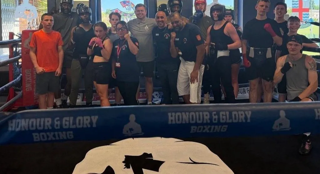Adults training together inside the Honour and Glory boxing gym