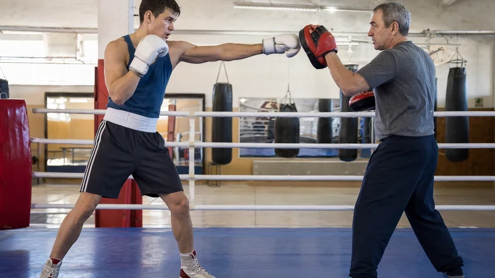 Coaching inside the ring with stance and distance being corrected