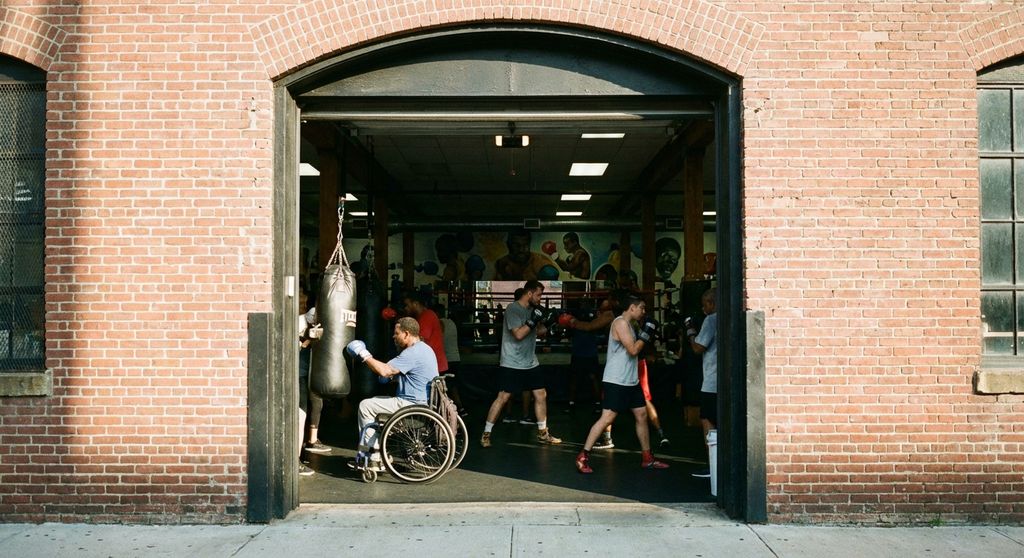 Open door to a community boxing gym - welcoming, no barriers to entry