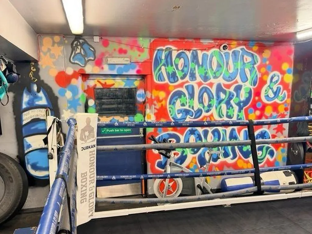 Inside Honour and Glory gym with ring space ready for footwork drills, sparring, and conditioning rounds