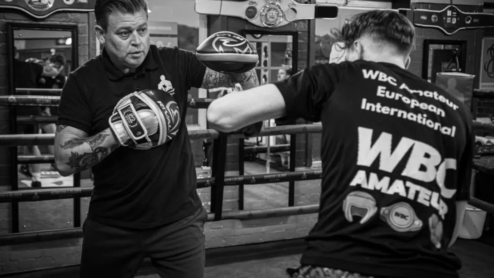 Coach Anton running pad work at Honour and Glory Boxing Club