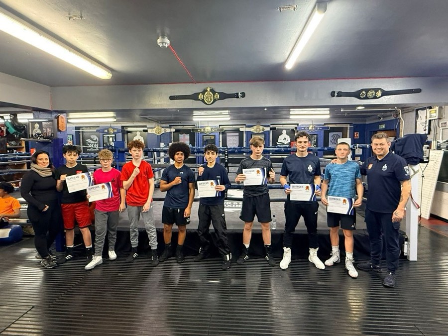 Young boxers receiving certificates