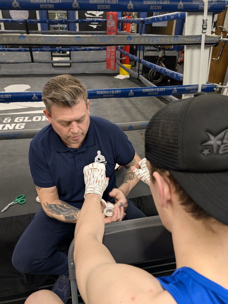 Coach Anton wrapping hands - one-to-one attention for beginners at Honour and Glory