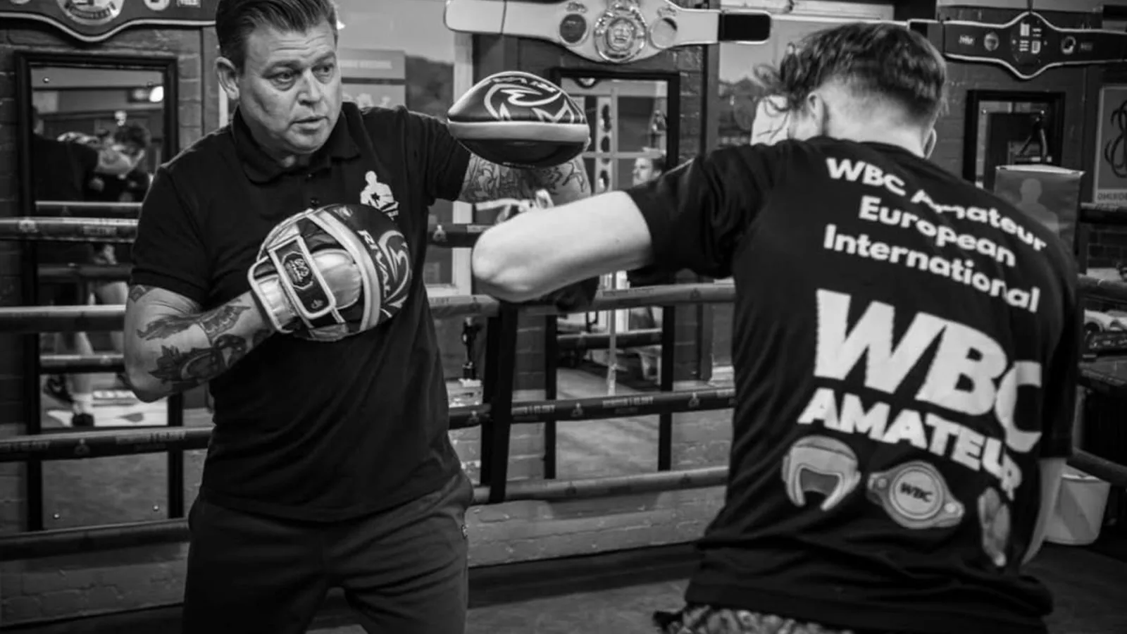 Anton coaching pad work during a personal training session