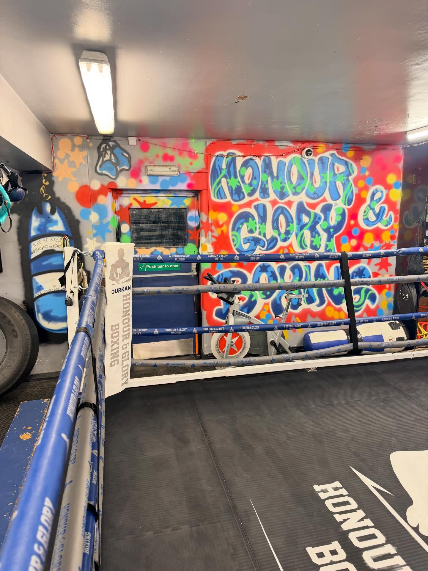 Inside the gym - ring and graffiti mural
