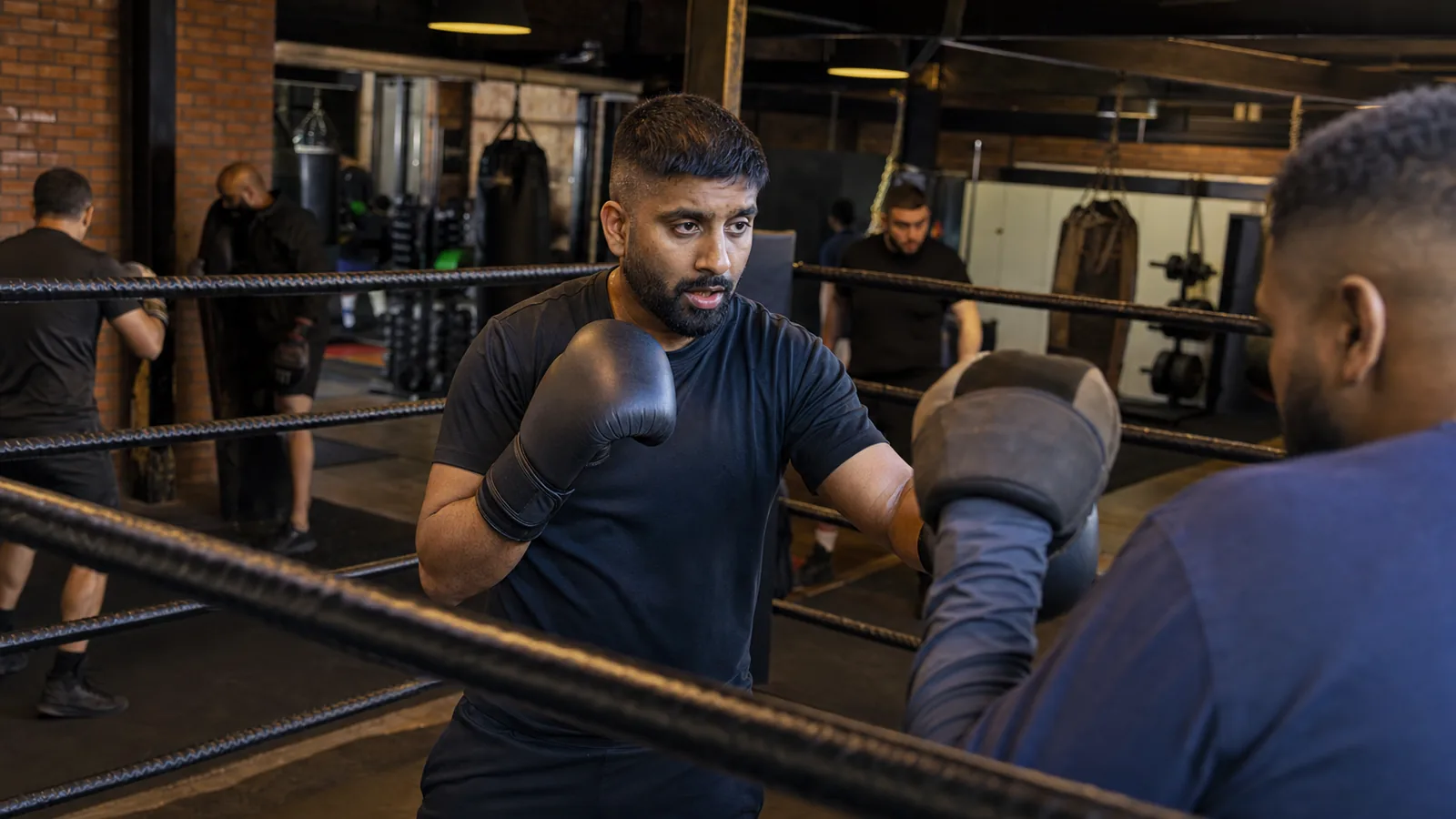 Coach-led boxing room at Honour and Glory for Thamesmead visitors choosing a first class