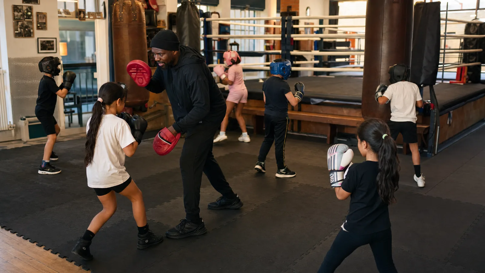 Junior boxing class learning supervised drills at Honour and Glory near Kidbrooke