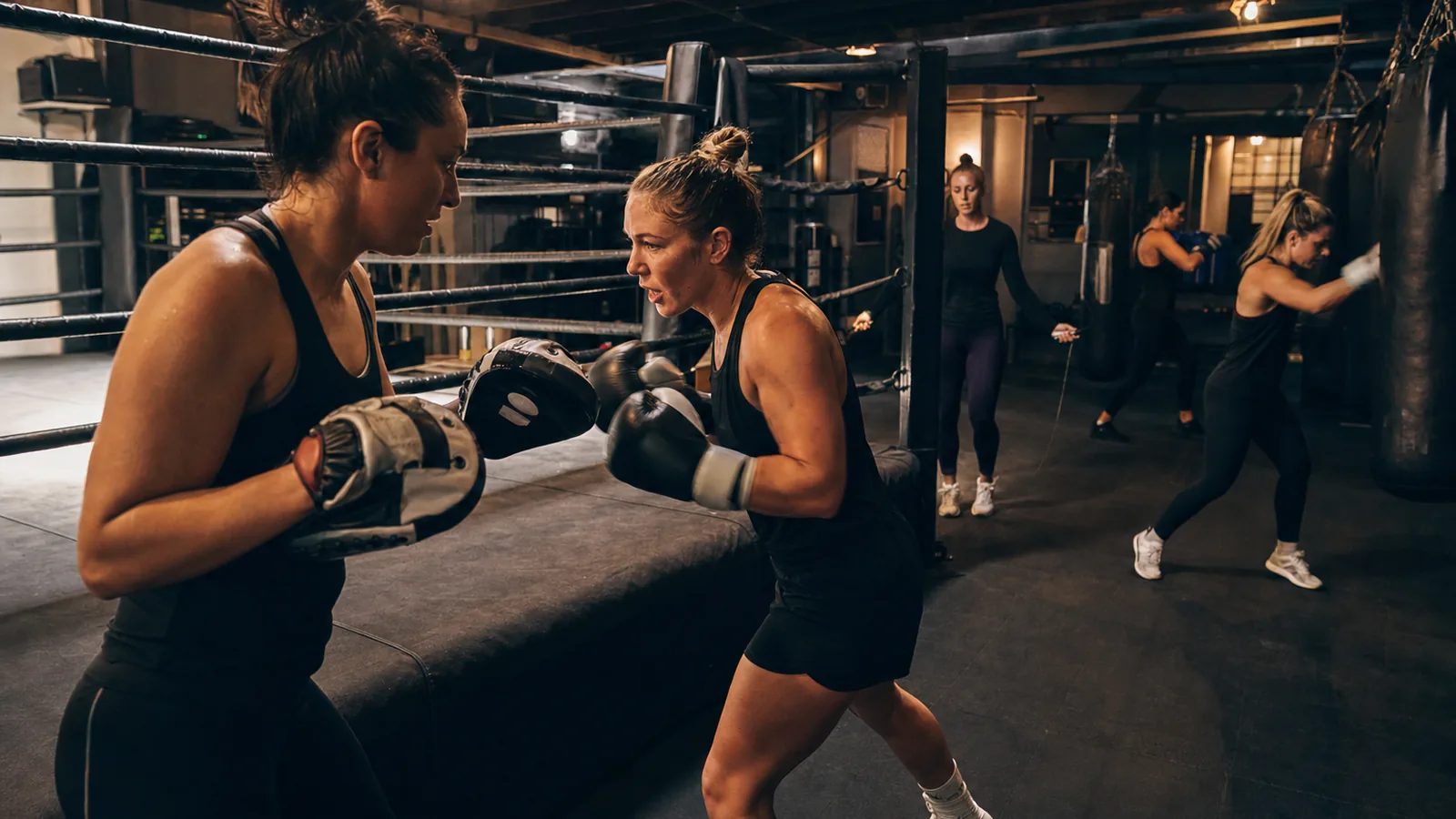 Women boxing together in a coached session near Falconwood