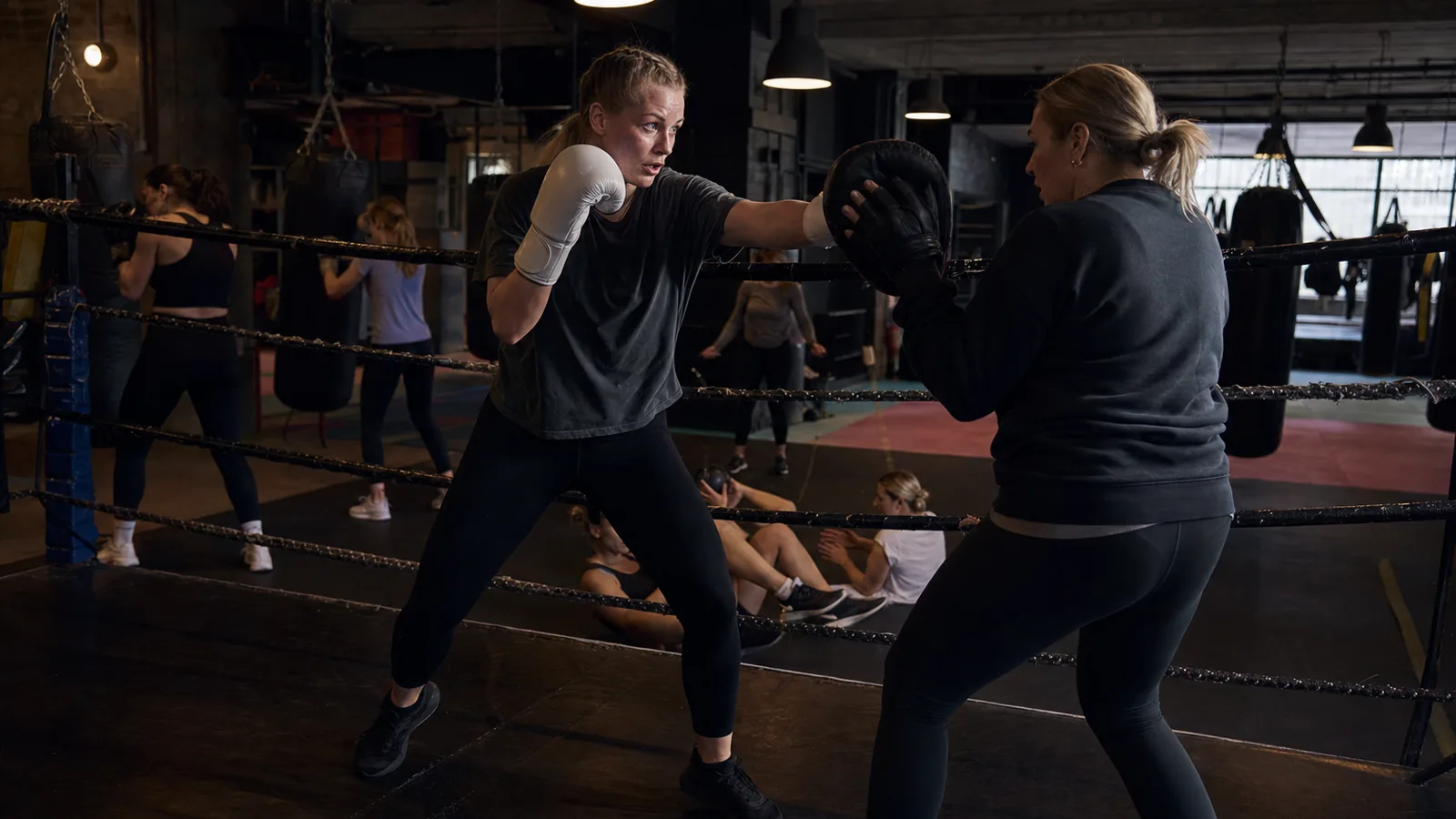Women training padwork at Honour and Glory