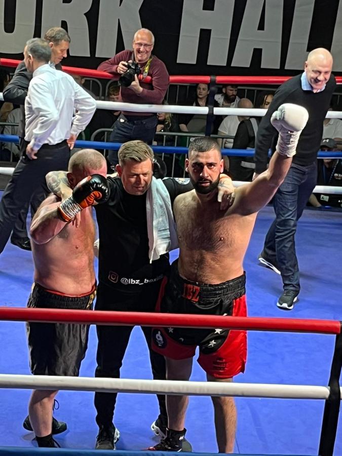 Professional boxing match - ring action under the lights