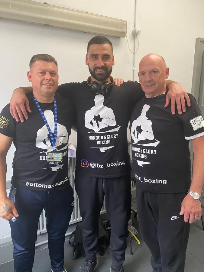 Anton Pattenden with a professional boxer and team